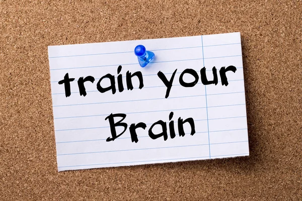 Train your Brain - teared note paper  pinned on bulletin board