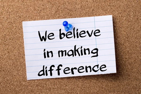 We believe in making difference - teared note paper  pinned on b