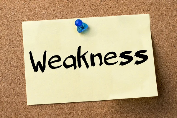 Weakness - adhesive label pinned on bulletin board