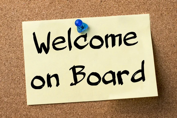 Welcome on Board - adhesive label pinned on bulletin board