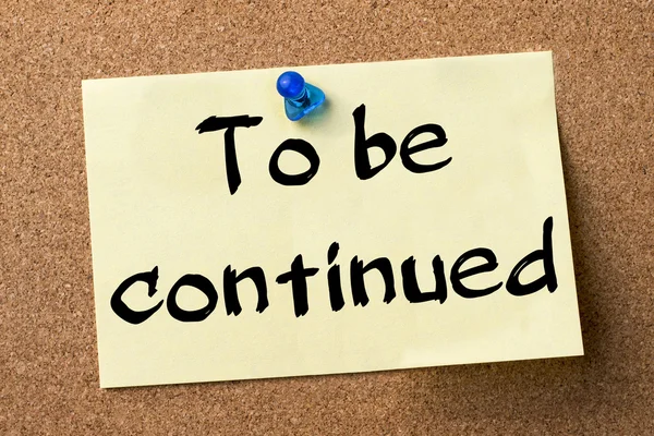 To be continued - adhesive label pinned on bulletin board