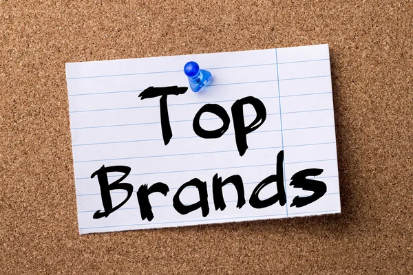 Top Brands - teared note paper pinned on bulletin board