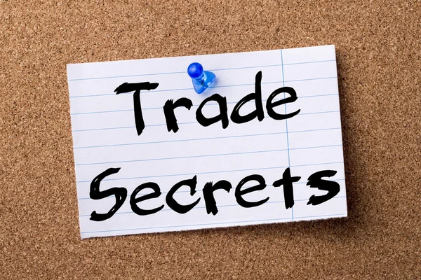 Trade Secrets - teared note paper pinned on bulletin board