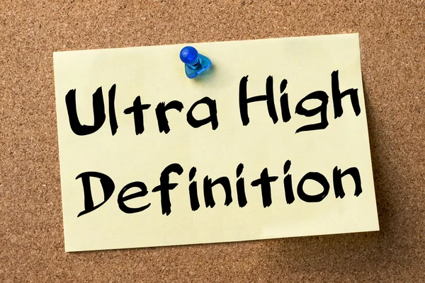 Ultra High Definition - adhesive label pinned on bulletin board