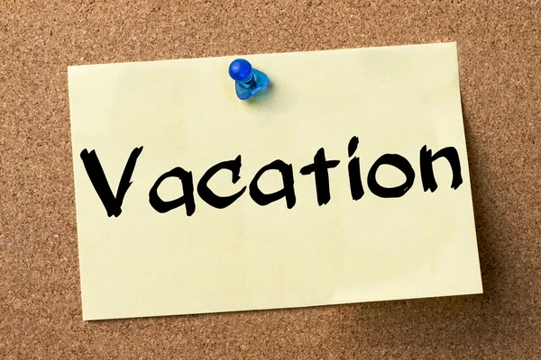 Vacation - adhesive label pinned on bulletin board