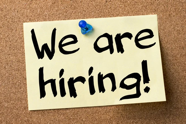 We are hiring!  - adhesive label pinned on bulletin board