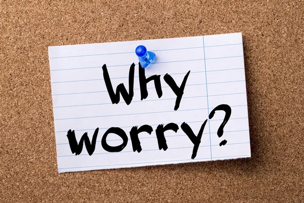 Why worry? - teared note paper pinned on bulletin board