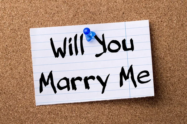 Will You Marry Me - teared note paper pinned on bulletin board