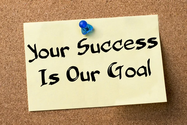 Your Success Is Our Goal - adhesive label pinned on bulletin boa