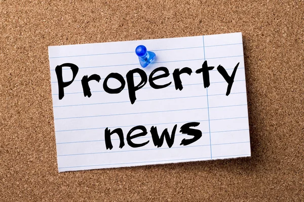 Property news - teared note paper pinned on bulletin board