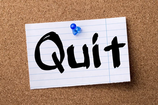 Quit - teared note paper pinned on bulletin board