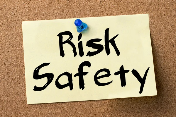 Risk Safety - adhesive label pinned on bulletin board