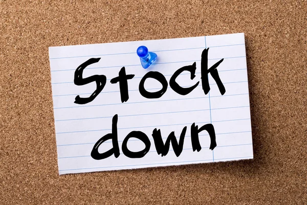 Stock down - teared note paper pinned on bulletin board