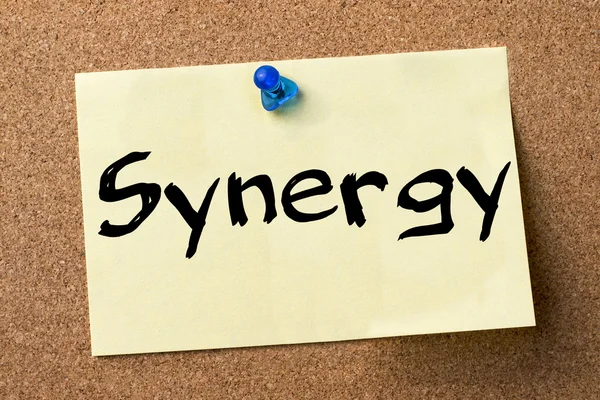 Synergy - adhesive label pinned on bulletin board