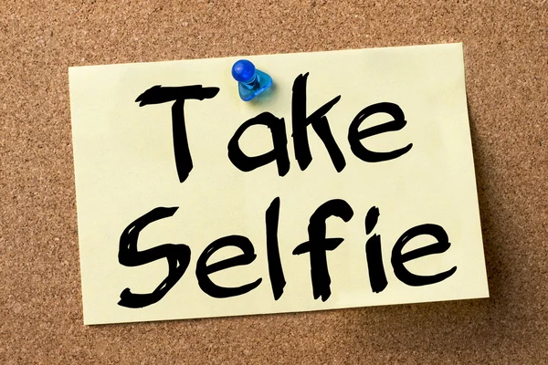 Take Selfie - adhesive label pinned on bulletin board
