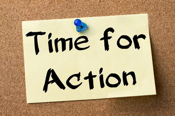 Time for Action - adhesive label pinned on bulletin board