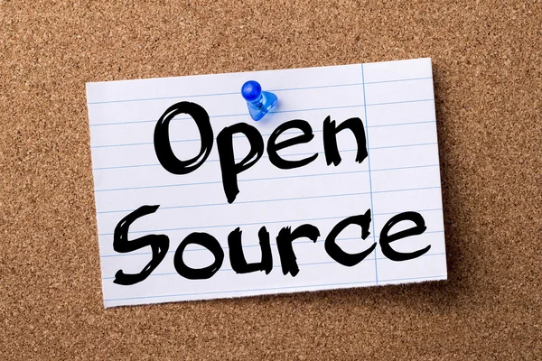 Open Source - teared note paper pinned on bulletin board