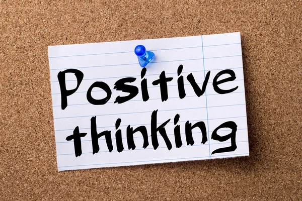 Positive thinking - teared note paper pinned on bulletin board
