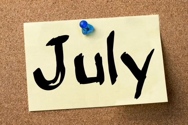July - adhesive label pinned on bulletin board