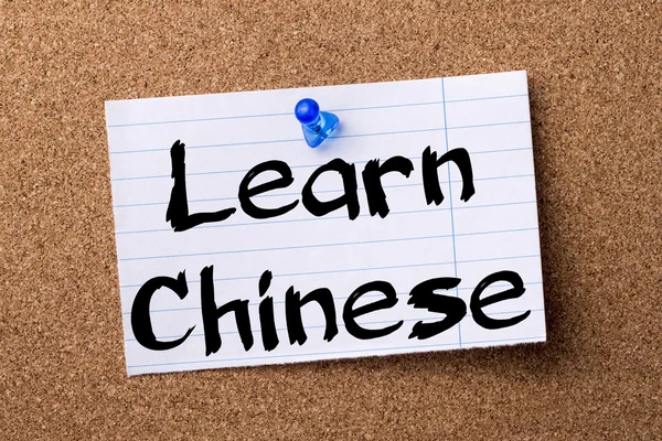 Learn Chinese - teared note paper pinned on bulletin board