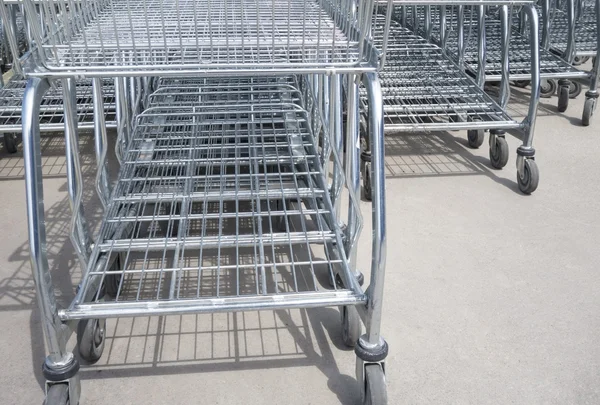 Rows of shopping carts on car park