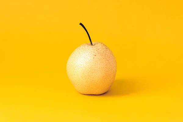 Under the background of pure color photograph of pear
