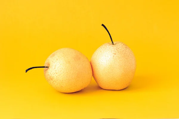 Under the background of pure color photograph of pear