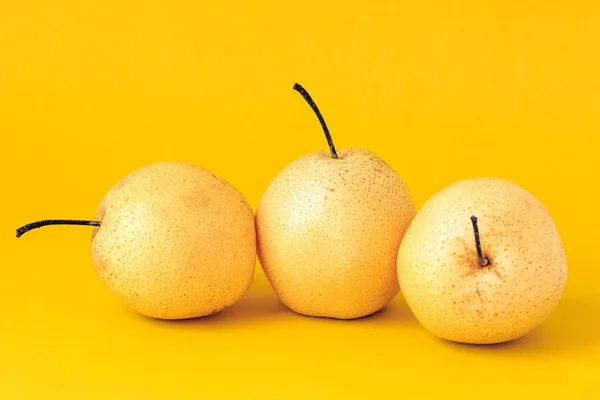 Under the background of pure color photograph of pear