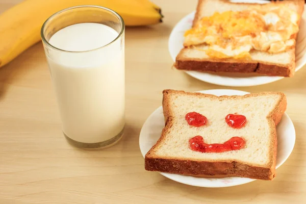 Bread and milk for breakfast eggs fruits