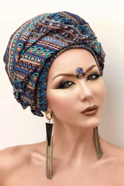 Portrait beautiful woman, arabic makeup, colorful turban