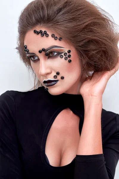 Girl, fashion makeup, black beads on face, dark lips,  portrait.