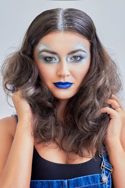 Beauty girl, blue lips, silver eyeshadow. Snowy hair. Young model