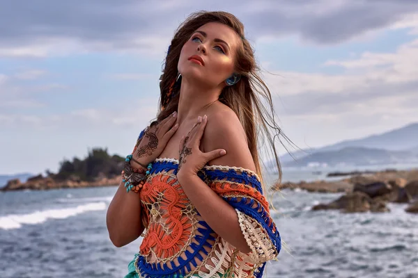 Ethnic fashion photo, beautiful sensual girl, bright clothes, ocean beach