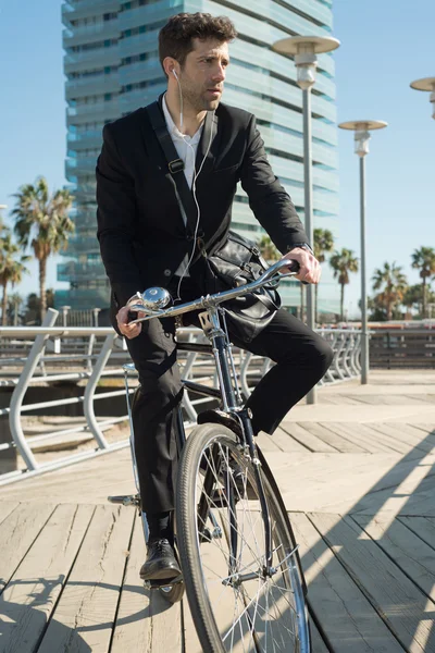 Young businessman in classical bike