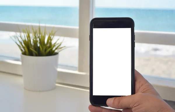 手与空白屏幕智能手机 - 图库照片ClaudioVald