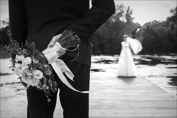 Wedding. Bride and groom. Bouquet for the bride . Black and white