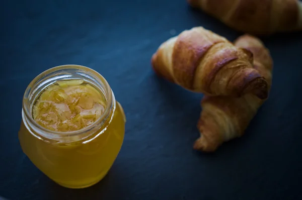Homemade organic orange marmalade with homebaked puff-pastry cro