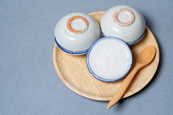 Coconut milk custard in small porcelain cup (Thai dessert)