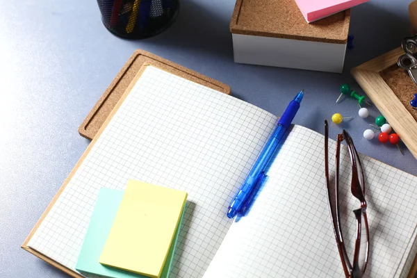 Office desk with papers and headphones