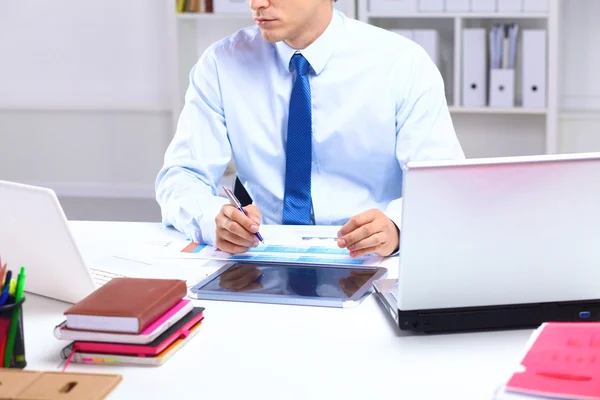 Businessman working at a desk computer graphics