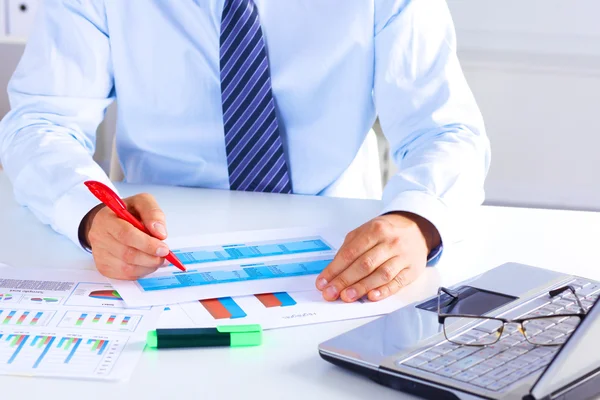 Businessman working at a desk computer graphics