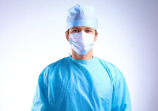 Young surgeon standing with his arms crossed