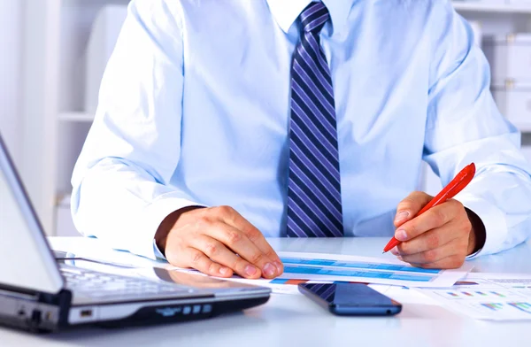 Businessman working at a desk computer graphics