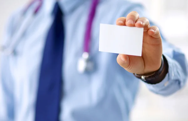 Doctor holding blank business card