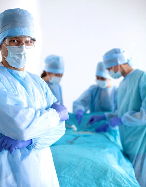 Team of surgeon in uniform perform operation on a patient at cardiac surgery clinic