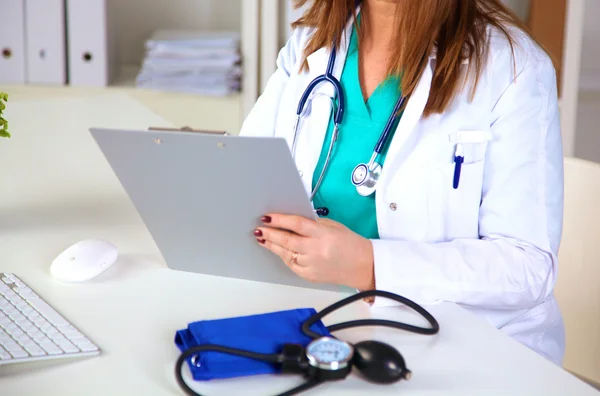 Portrait of happy medical doctor woman in office