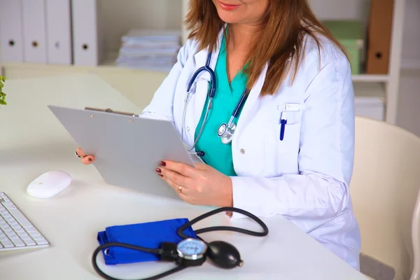 Portrait of happy medical doctor woman in office