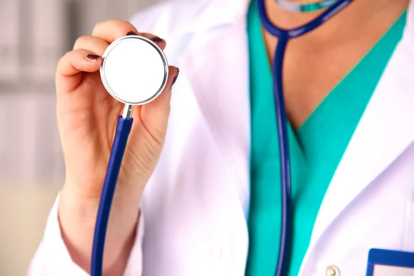 Portrait of happy medical doctor woman in office