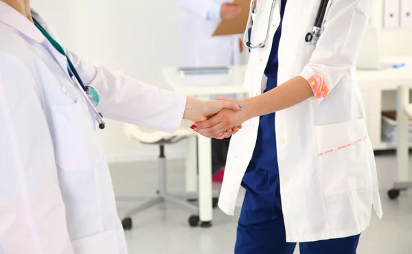 Young medical people handshaking at office, hospital