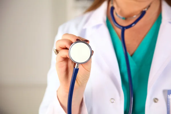 Portrait of happy medical doctor woman in office